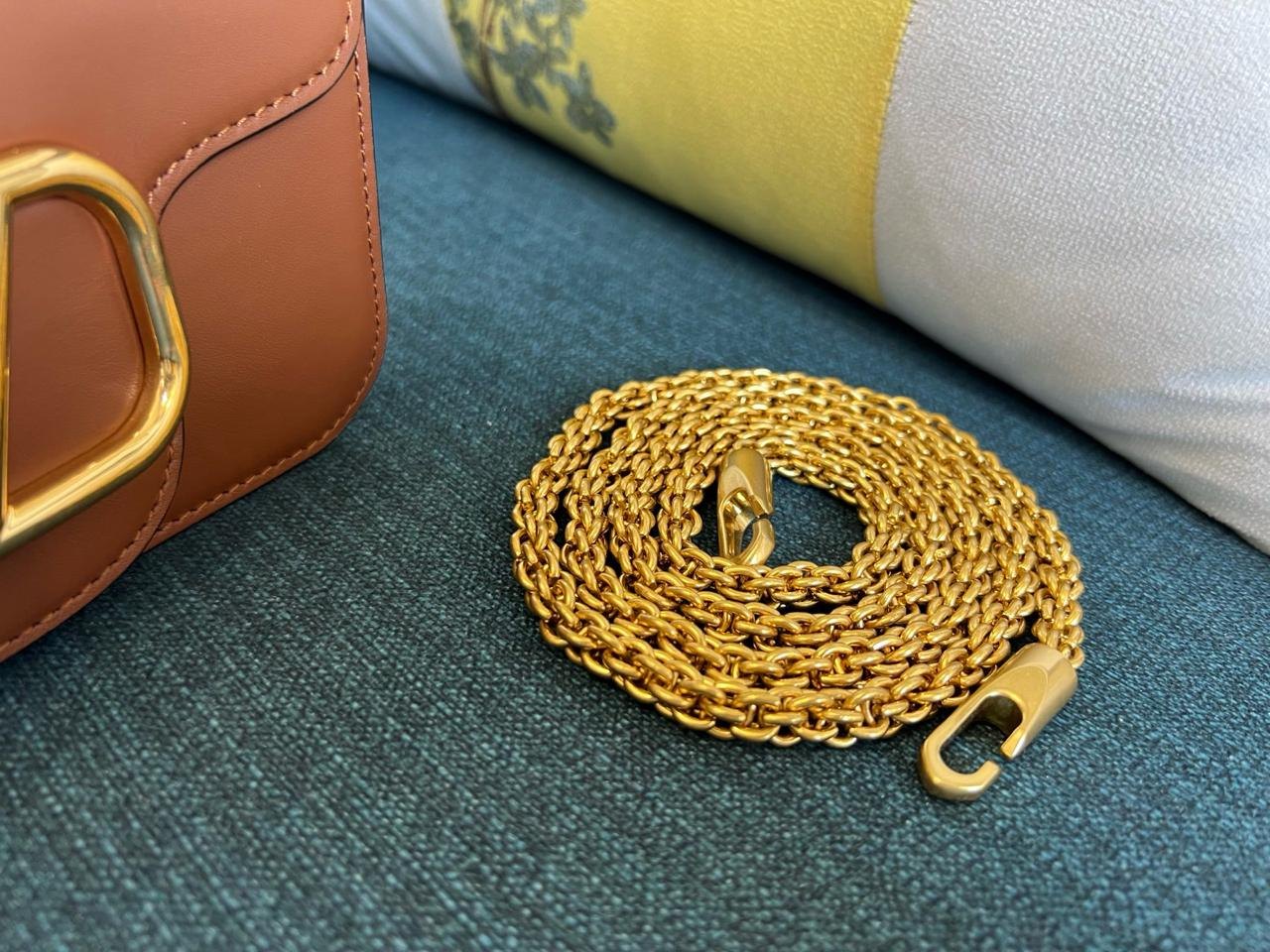 Valentino Garavani Locò Small Shoulder Bag.