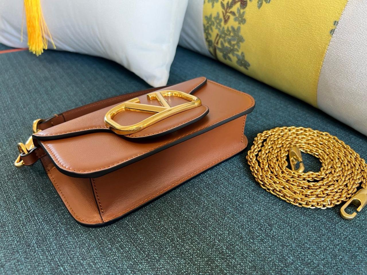 Valentino Garavani Locò Small Shoulder Bag.