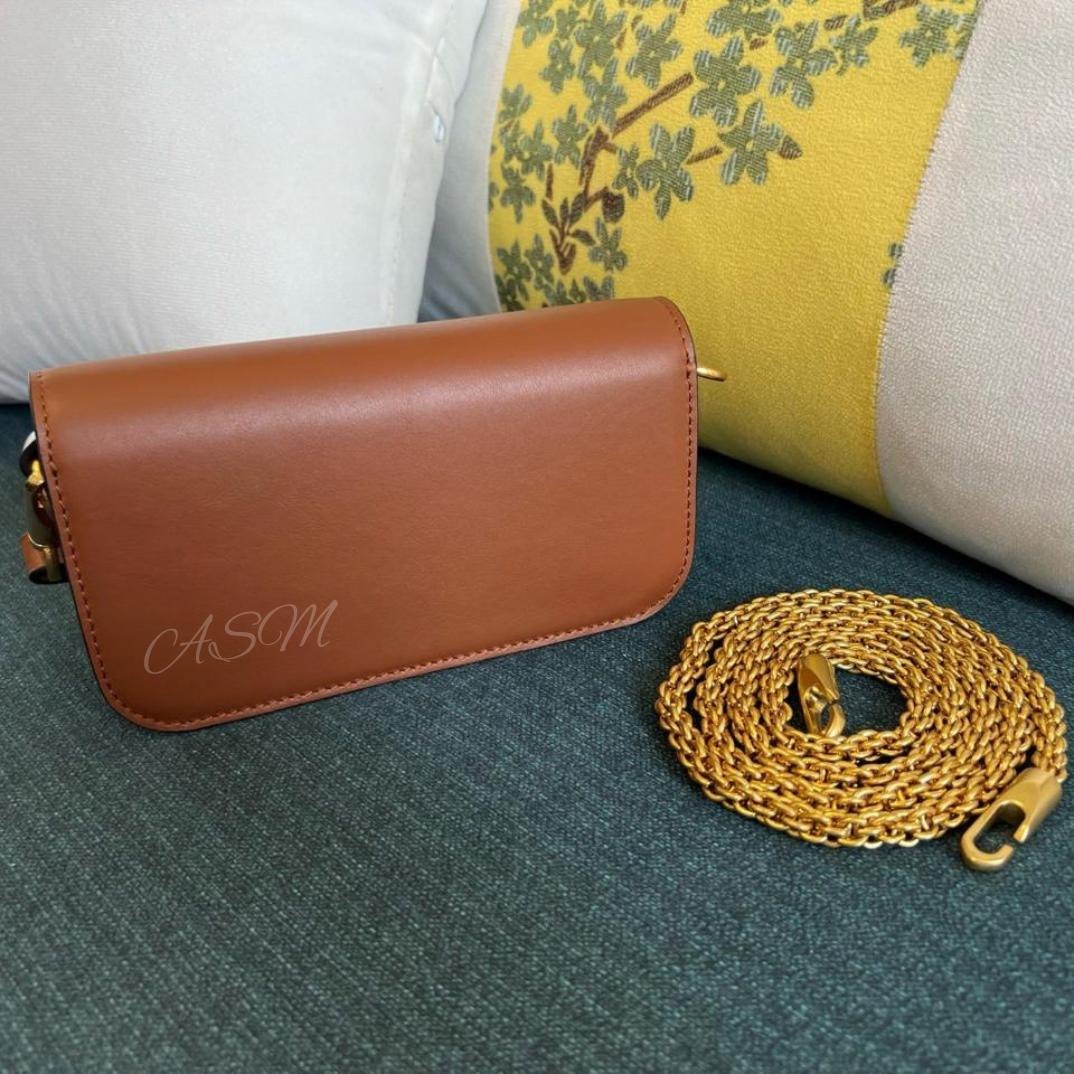 Valentino Garavani Locò Small Shoulder Bag.