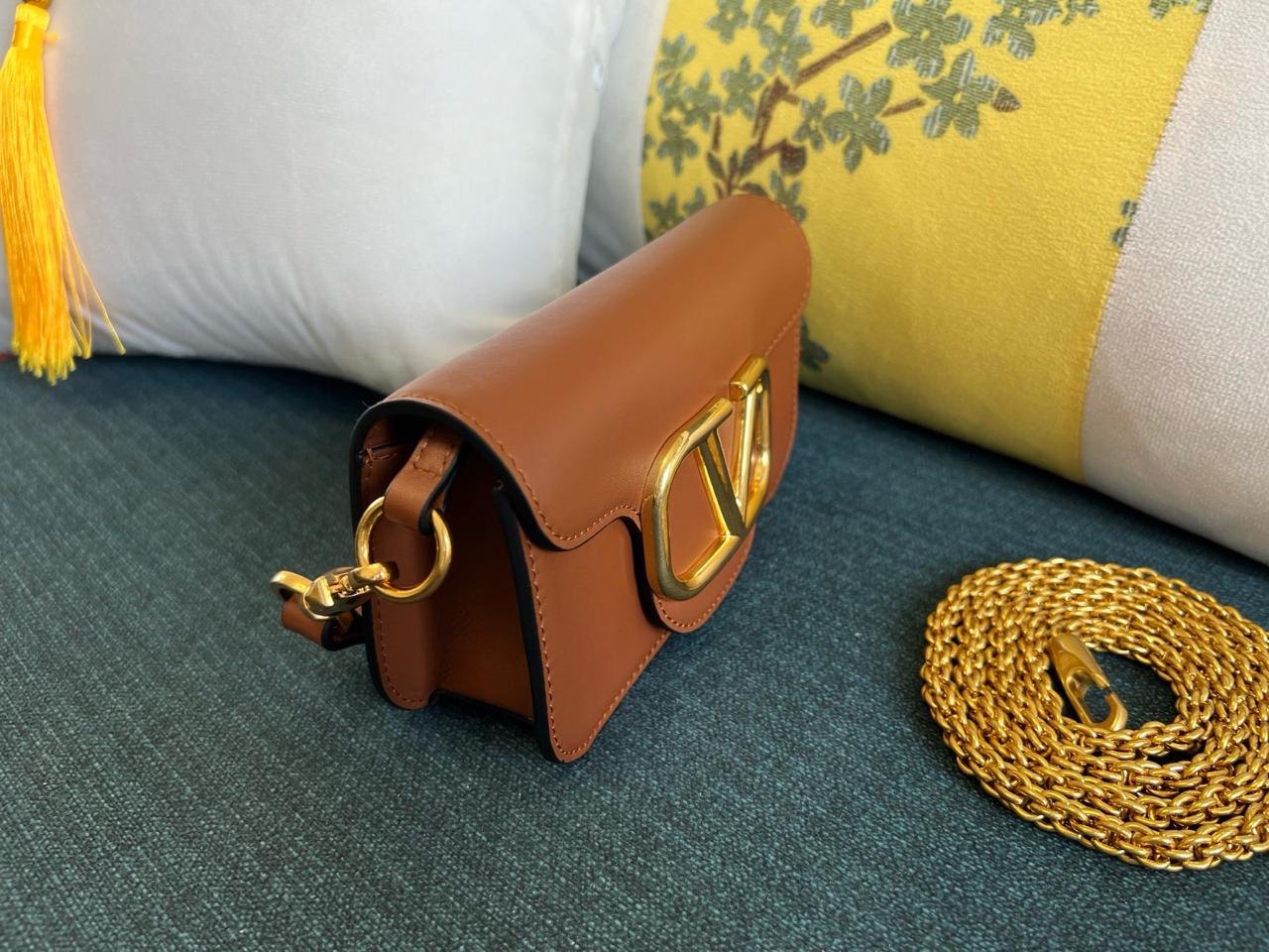 Valentino Garavani Locò Small Shoulder Bag.