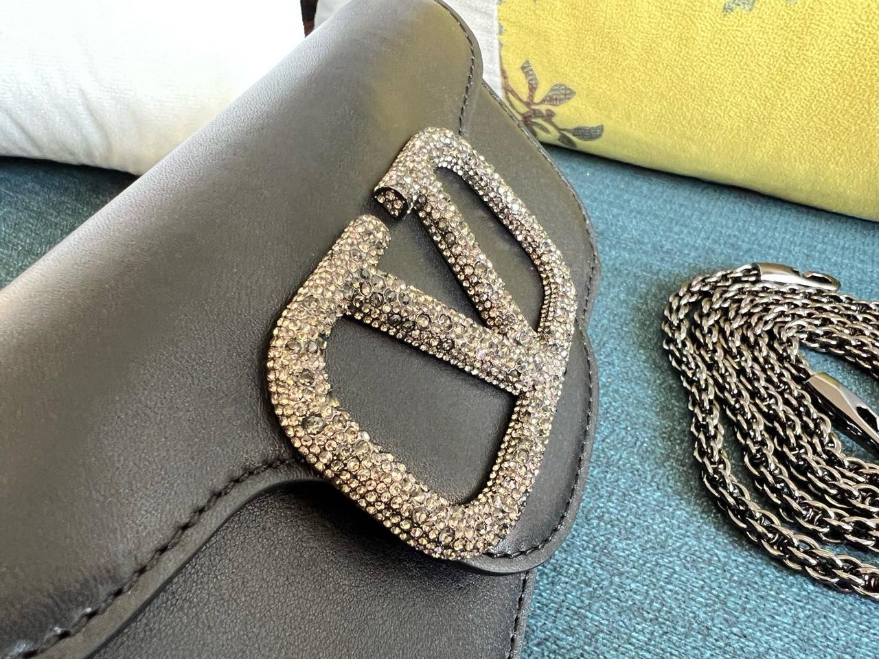 Valentino Garavani Locò Small Shoulder Bag with Jewel Logo.