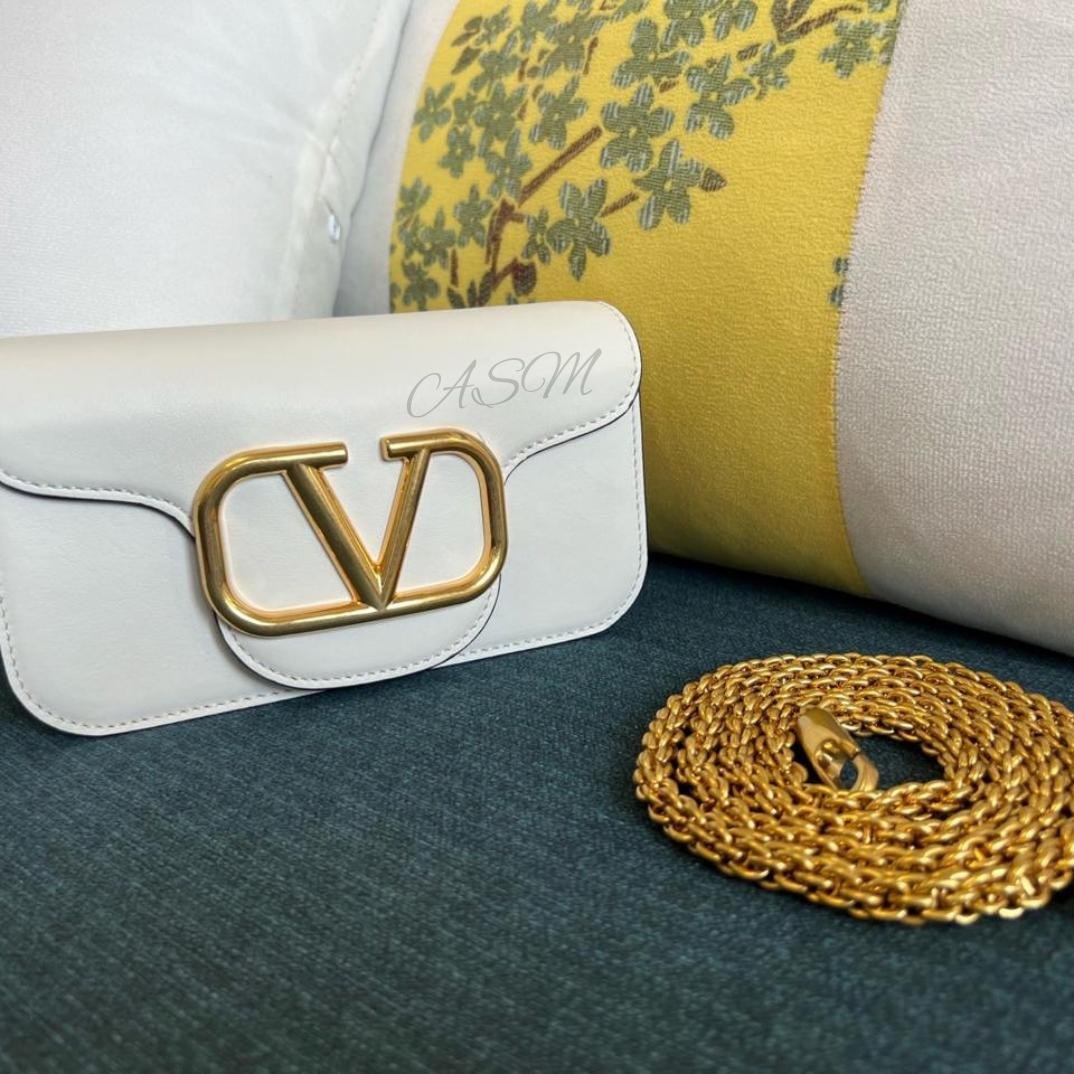 Valentino Garavani Locò Small Shoulder Bag.