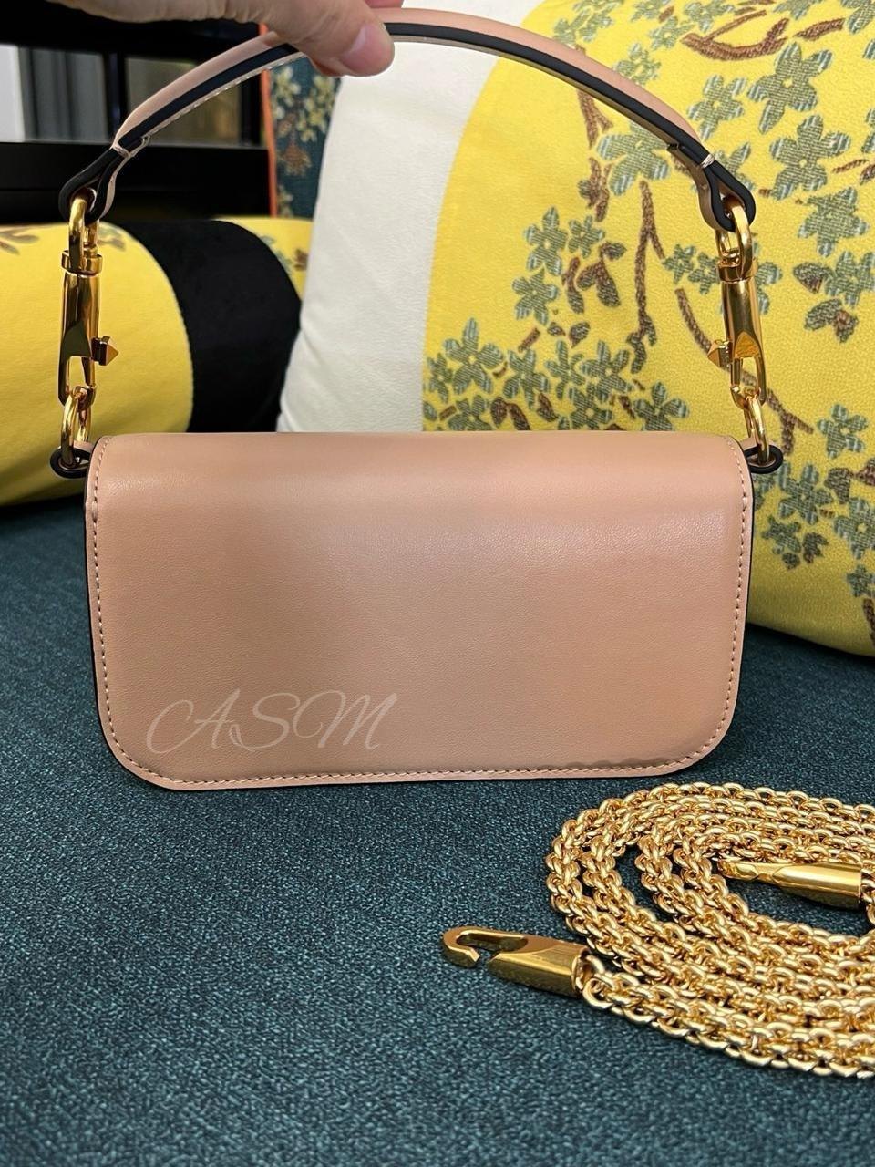Valentino Garavani Locò Bag with Jewel Logo.