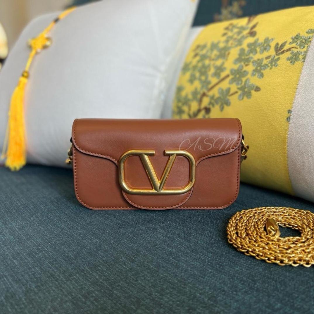 Valentino Garavani Locò Small Shoulder Bag.