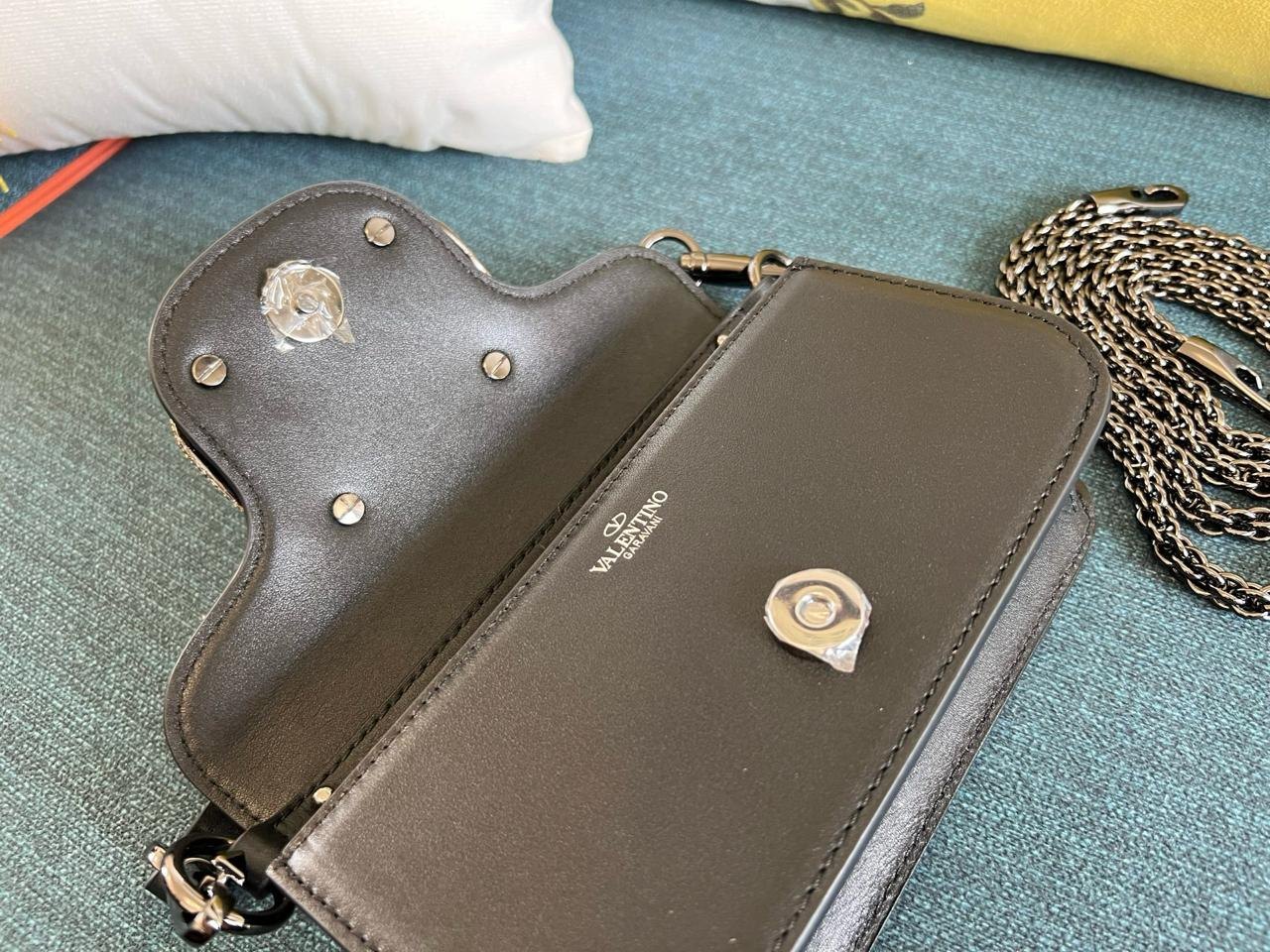 Valentino Garavani Locò Small Shoulder Bag with Jewel Logo.